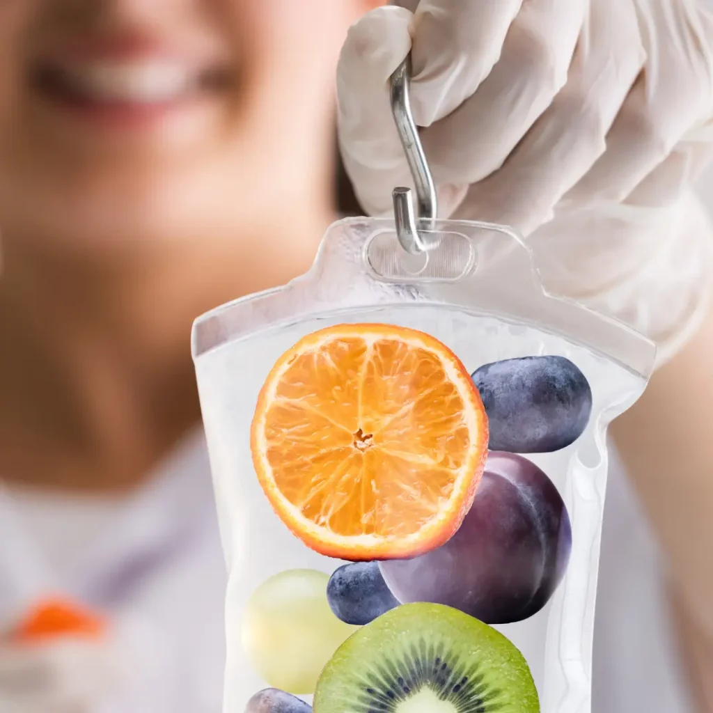 Nurse holding IV hydration bag with fruits for vitamin infusion therapy at The IV Station in Apple Valley